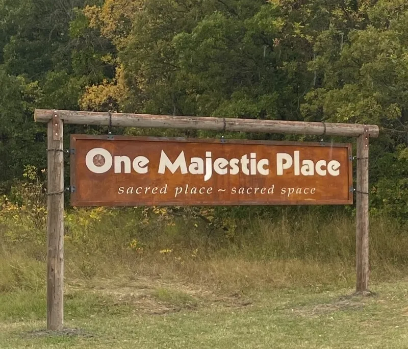Sign reading 'One Majestic Place' outdoors.